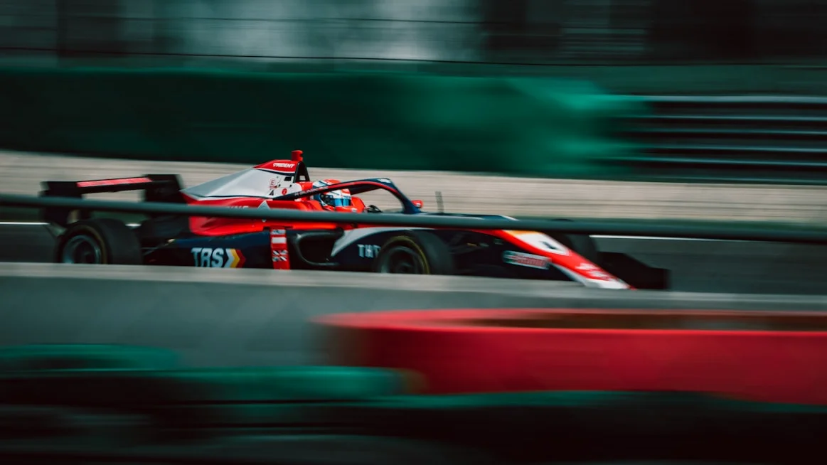 Formula 1 race car racing around a high-speed circuit
